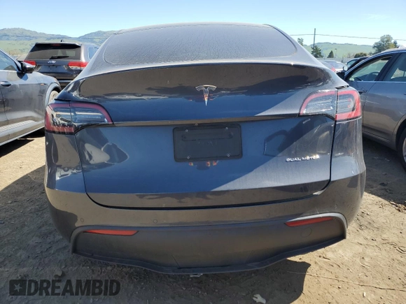 2022 Tesla Model Y Long Range with VIN 7SAYGDEE2NF402320, listed as a Copart auction lot 50396605 with 27,426 mi miles and Salvage Title. Bid and sale history available at DreamBid. Image 6.