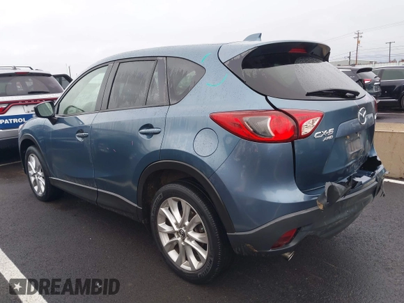 2015 Mazda CX-5 Grand Touring with VIN JM3KE4DY0F0493969, listed as a IAAI auction lot 41581885 with 71,014 mi miles. Bid and sale history available at carsss.com. Image 3.