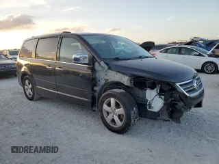 2013 Volkswagen Routan z VIN 2C4RVADG8DR725749, wystawiony jako Copart lot #77624324 z przebiegiem 156 557 mil mil oraz Czysty tytuł • Clean title. Historia ofert i sprzedaży dostępna na DreamBid. Obrazek 4.