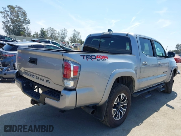 2021 Toyota Tacoma SR with VIN 3TMCZ5AN6MM393306, listed as a IAAI auction lot 42094095 with 57,217 mi miles and . Bid and sale history available at DreamBid. Image 4.