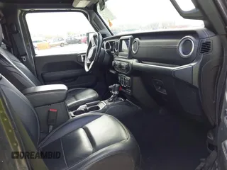 2019 Jeep Wrangler Unlimited Sahara with VIN 1C4HJXEN3KW622167, listed as a IAAI auction lot 41880702 with 72,928 mi miles and . Bid and sale history available at DreamBid. Image 5.
