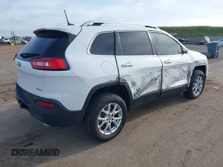 2016 Jeep Cherokee Latitude with VIN 1C4PJMCS1GW185442, listed as a IAAI auction lot 42033699 with 123,306 mi miles. Bid and sale history available at carsss.com. Image 4.