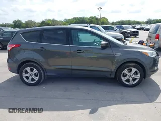 2015 Ford Escape SE with VIN 1FMCU0G7XFUA89965, listed as a IAAI auction lot 42072553 with 129,877 mi miles. Bid and sale history available at carsss.com. Image 13.