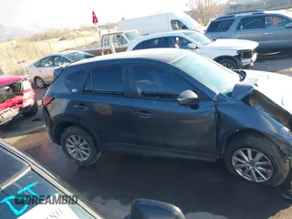 2016 Mazda CX-5 Touring with VIN JM3KE4CY0G0751040, listed as a IAAI auction lot 41290780 with 136,689 mi miles. Bid and sale history available at carsss.com. Image 14.