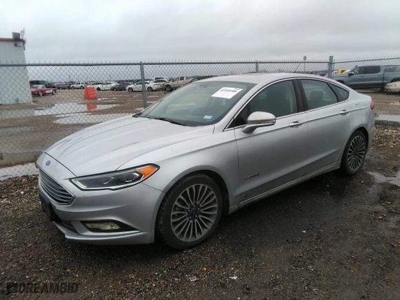 2018 Ford Fusion Hybrid Titanium with VIN 3FA6P0RUXJR207174, listed as a IAAI auction lot 41549400 with 242,901 mi miles. Bid and sale history available at carsss.com. Image 17.