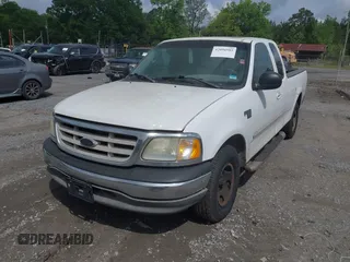 2003 Ford F-150 XL with VIN 1FTRX17L93NB61902, listed as a IAAI auction lot 42096982 with 318,850 mi miles. Bid and sale history available at carsss.com. Image 2.