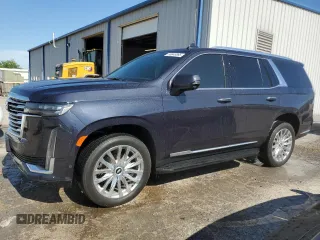 2022 Cadillac Escalade 4WD Premium Luxury z VIN 1GYS4BKLXNR332220, wystawiony jako Copart lot #56849895 z przebiegiem 12 873 mil mil oraz Tytuł czysty. Historia ofert i sprzedaży dostępna na DreamBid. Obrazek 1.