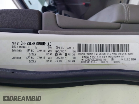 2012 Jeep Grand Cherokee Laredo with VIN 1C4RJFAG5CC224032, listed as a IAAI auction lot 42069334 with 106,614 mi miles. Bid and sale history available at carsss.com. Image 9.