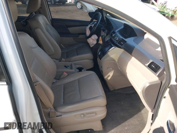 2014 Honda Odyssey Touring with VIN 5FNRL5H97EB037358, listed as a IAAI auction lot 41832825 with 208,894 mi miles and . Bid and sale history available at DreamBid. Image 5.
