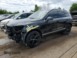 2017 Volkswagen Touareg Wolfsburg Edition with VIN WVGRF7BP5HD004148, listed as a Copart auction lot 60596085 with 116,860 mi miles and Salvage title. Bid and sale history available at DreamBid. Image 1.