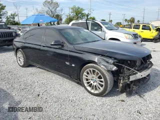 2014 BMW 7 Series 740Li with VIN WBAYE4C52ED138770, listed as a Copart auction lot 53647665 with 106,827 mi miles and Salvage title. Bid and sale history available at DreamBid. Image 4.