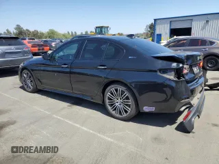 2018 BMW 5 Series 530e with VIN WBAJA9C50JB252458, listed as a Copart auction lot 58697585 with 89,050 mi miles and Salvage title. Bid and sale history available at DreamBid. Image 2.