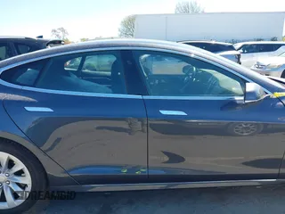 2017 Tesla Model S 100D with VIN 5YJSA1E20HF198503, listed as a IAAI auction lot 41843782 with 77,281 mi miles and . Bid and sale history available at DreamBid. Image 14.