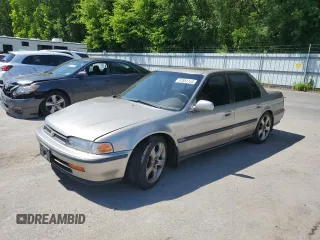 1992 Honda Accord with VIN 1HGCB7671NA082828, listed as a Copart auction lot 57551185 with 188,393 mi miles and Salvage title. Bid and sale history available at DreamBid. Image 1.