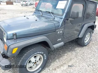 2002 Jeep Wrangler X with VIN 1J4FA39S92P736825, listed as a IAAI auction lot 42156410 with 196,313 mi miles. Bid and sale history available at carsss.com. Image 6.