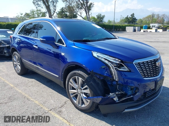 2023 Cadillac XT5 FWD Premium Luxury z VIN 1GYKNCRS3PZ176654, wystawiony jako IAAI lot #42136259 z przebiegiem 20 403 mil mil oraz . Historia ofert i sprzedaży dostępna na DreamBid. Obrazek 1.