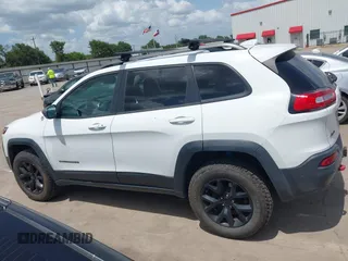 2014 Jeep Cherokee Trailhawk with VIN 1C4PJMBS5EW231448, listed as a IAAI auction lot 42632143 with 97,461 mi miles and . Bid and sale history available at DreamBid. Image 14.