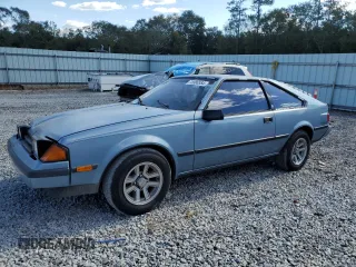 1983 Toyota Celica z VIN JT2RA64L7D6174381, wystawiony jako Copart lot #75986554 z przebiegiem 312 583 mil mil oraz Szkoda całkowita • Salvage title. Historia ofert i sprzedaży dostępna na DreamBid. Obrazek 1.