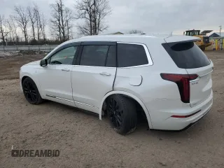 2022 Cadillac XT6 Premium Luxury with VIN 1GYKPFRS2NZ120147, listed as a Copart auction lot 49047855 with 59,691 mi miles and Salvage Title. Bid and sale history available at carsss.com. Image 2.