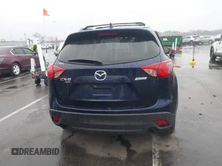 2014 Mazda CX-5 Grand Touring with VIN JM3KE4DY8E0366644, listed as a IAAI auction lot 41971438 with 135,644 mi miles and . Bid and sale history available at carsss.com. Image 16.
