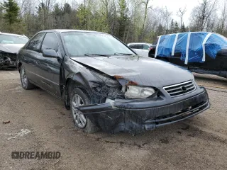 2001 Toyota Camry LE z VIN JT2BF22K010295564, wystawiony jako Copart lot #55111755 z przebiegiem 379 337 mil mil oraz Szkody całkowita. Historia ofert i sprzedaży dostępna na DreamBid. Obrazek 4.