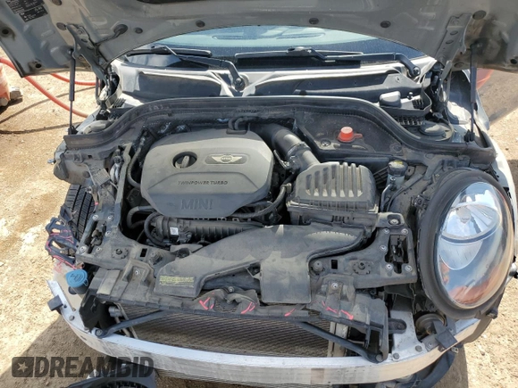 2015 MINI Hardtop with VIN WMWXM5C5XFT974077, listed as a Copart auction lot 58063965 with 93,853 mi miles and Salvage title. Bid and sale history available at DreamBid. Image 11.