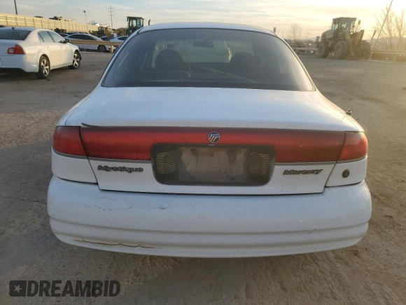 1999 Mercury Mystique GS z VIN 1MEFM6532XK638087, wystawiony jako Copart lot #85269414 z przebiegiem 192 506 mil mil oraz Szkody całkowita. Historia ofert i sprzedaży dostępna na DreamBid. Obrazek 6.