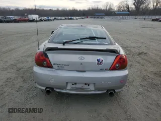 2003 Hyundai Tiburon GT z VIN KMHHN65F63U064962, wystawiony jako Copart lot #44804045 z przebiegiem 186 171 mil mil oraz Szkoda całkowita • Salvage title. Historia ofert i sprzedaży dostępna na DreamBid. Obrazek 6.