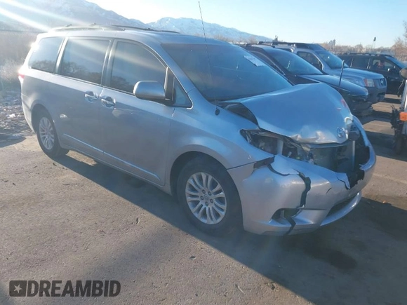 2014 Toyota Sienna XLE z VIN 5TDYK3DC9ES508300, wystawiony jako IAAI lot #41867307 z przebiegiem 93 798 mil mil oraz . Historia ofert i sprzedaży dostępna na DreamBid. Obrazek 1.