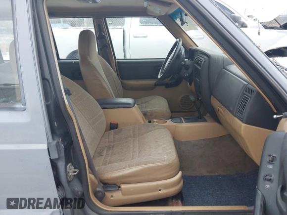1999 Jeep Cherokee Sport with VIN 1J4FT68S1XL511195, listed as a IAAI auction lot 41651025 with Not provided miles and . Bid and sale history available at DreamBid. Image 5.