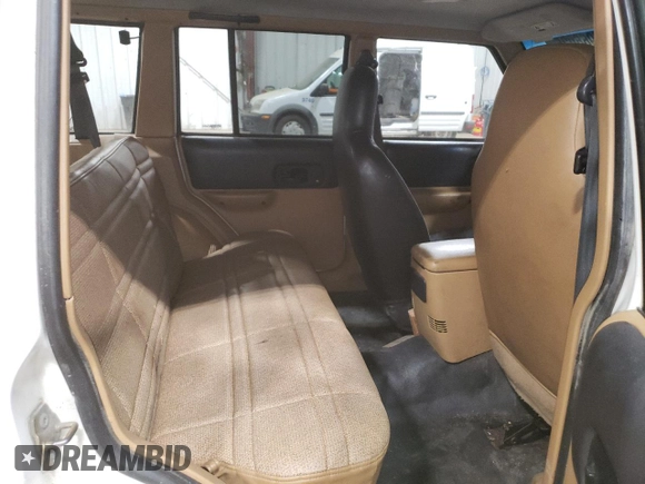 1998 Jeep Cherokee Sport with VIN 1J4FJ68S2WL239891, listed as a Copart auction lot 62966025 with 128,226 mi miles and Clean title. Bid and sale history available at DreamBid. Image 11.
