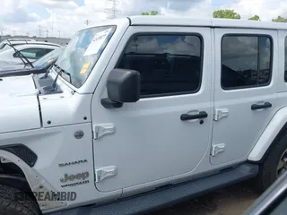 2018 Jeep Wrangler Unlimited Sahara with VIN 1C4HJXEG1JW205789, listed as a IAAI auction lot 42435877 with 57,587 mi miles and . Bid and sale history available at DreamBid. Image 15.