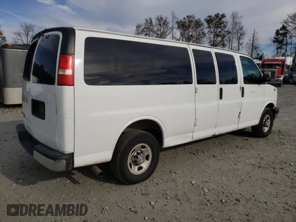 2014 Chevrolet Express Passenger LT with VIN 1GAZG1FG2E1202457, listed as a Copart auction lot 82704884 with 142,982 mi miles and Salvage title. Bid and sale history available at DreamBid. Image 3.