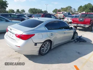 2014 Infiniti Q50 with VIN JN1BV7AP4EM677506, listed as a IAAI auction lot 40113207 with 142,446 mi miles and . Bid and sale history available at DreamBid. Image 4.