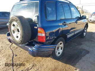 2003 Suzuki Vitara z VIN 2S3TE52V436101091, wystawiony jako IAAI lot #41472279 z przebiegiem 163 429 mil mil oraz . Historia ofert i sprzedaży dostępna na DreamBid. Obrazek 6.