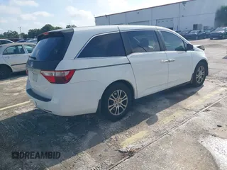 2012 Honda Odyssey EX-L z VIN 5FNRL5H61CB032353, wystawiony jako IAAI lot #42471691 z przebiegiem 186 257 mil mil oraz . Historia ofert i sprzedaży dostępna na DreamBid. Obrazek 4.