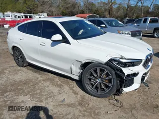 2023 BMW X6 xDrive40i z VIN 5UXCY6C00P9N46581, wystawiony jako IAAI lot #41417378 z przebiegiem 35 085 mil mil oraz . Historia ofert i sprzedaży dostępna na DreamBid. Obrazek 1.