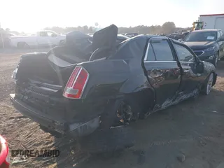 2014 Chrysler 300 with VIN 2C3CCAEGXEH120136, listed as a IAAI auction lot 41020040 with 125,887 mi miles. Bid and sale history available at carsss.com. Image 4.