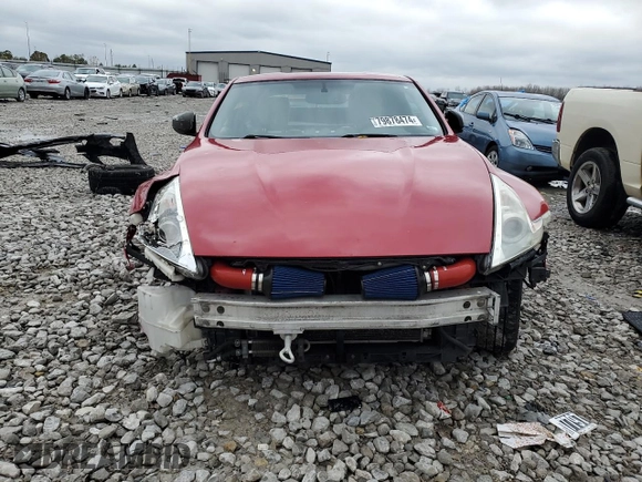 2009 Nissan 370Z z VIN JN1AZ44E19M400603, wystawiony jako Copart lot #79878474 z przebiegiem 129 976 mil mil oraz Szkoda całkowita • Salvage title. Historia ofert i sprzedaży dostępna na DreamBid. Obrazek 5.