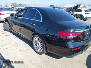 2021 Mercedes-Benz E-Class E 350 with VIN W1KZF8DB0MA889890, listed as a IAAI auction lot 41317094 with 63,075 mi miles. Bid and sale history available at carsss.com. Image 3.