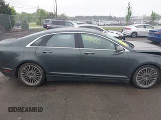 2015 Lincoln MKZ Hybrid z VIN 3LN6L2LU7FR618867, wystawiony jako IAAI lot #42291650 z przebiegiem 109 021 mil mil oraz . Historia ofert i sprzedaży dostępna na DreamBid. Obrazek 13.