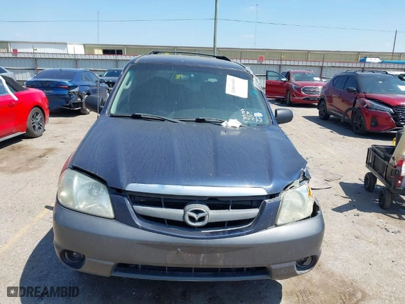 2003 Mazda Tribute LX with VIN 4F2CZ04133KM23234, listed as a IAAI auction lot 41869955 with 240,898 mi miles. Bid and sale history available at carsss.com. Image 12.