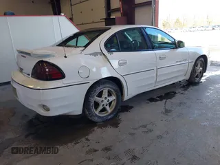 1999 Pontiac Grand Am GT1 with VIN 1G2NW52E2XM800431, listed as a IAAI auction lot 41620806 with 164,257 mi miles. Bid and sale history available at carsss.com. Image 4.