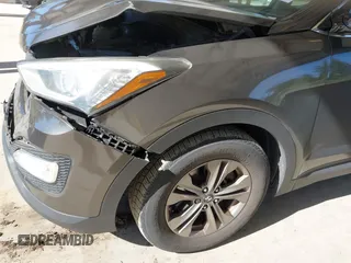 2014 Hyundai Santa Fe z VIN 5XYZUDLB0EG187192, wystawiony jako IAAI lot #42360255 z przebiegiem 154 607 mil mil oraz . Historia ofert i sprzedaży dostępna na DreamBid. Obrazek 6.