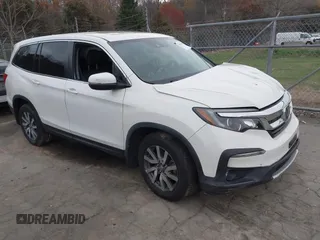 2019 Honda Pilot EX-L with VIN 5FNYF6H59KB075577, listed as a IAAI auction lot 41863841 with 102,242 mi miles and . Bid and sale history available at carsss.com. Image 1.