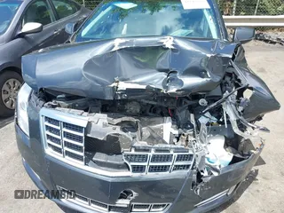 2013 Cadillac XTS Luxury z VIN 2G61P5S34D9109189, wystawiony jako IAAI lot #42242533 z przebiegiem 178 234 mil mil oraz . Historia ofert i sprzedaży dostępna na DreamBid. Obrazek 6.