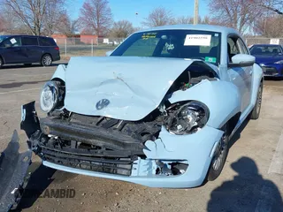 2014 Volkswagen Beetle 2.5L w/Sun with VIN 3VWJP7AT6EM601318, listed as a IAAI auction lot 41902598 with 169,220 mi miles and . Bid and sale history available at DreamBid. Image 6.