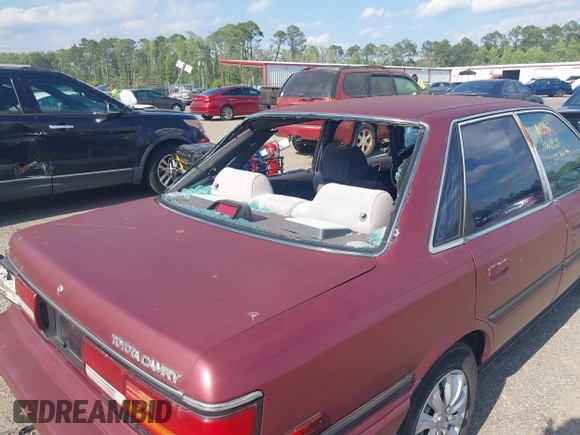 1991 Toyota Camry DLX z VIN 4T1SV21E0MU347371, wystawiony jako IAAI lot #42048695 z przebiegiem 209 451 mil mil oraz . Historia ofert i sprzedaży dostępna na DreamBid. Obrazek 12.