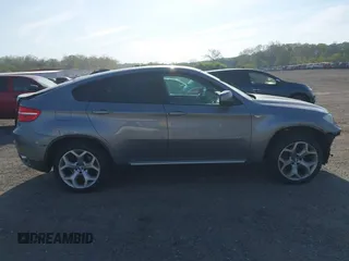 2014 BMW X6 xDrive35i z VIN 5UXFG2C57E0H10305, wystawiony jako IAAI lot #42109416 z przebiegiem 144 816 mil mil oraz . Historia ofert i sprzedaży dostępna na DreamBid. Obrazek 14.