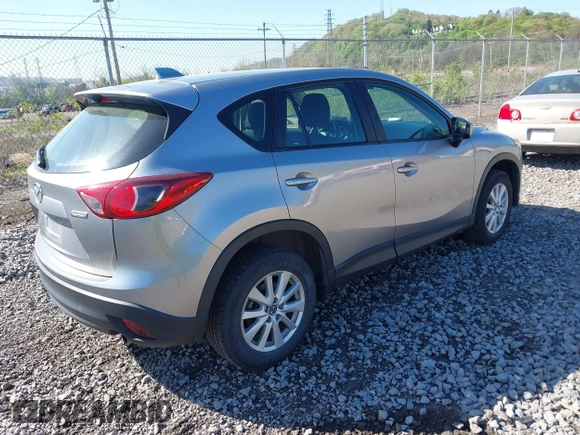 2013 Mazda CX-5 Sport with VIN JM3KE4BE0D0125748, listed as a IAAI auction lot 42143020 with 158,580 mi miles. Bid and sale history available at carsss.com. Image 4.